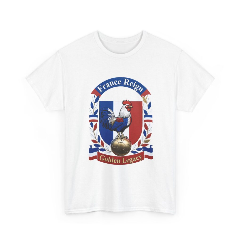 White t-shirt mockup hanging on a wooden hanger against a light gray background, featuring a bold French national team-inspired crest design. At the center is a proud Gallic rooster in blue, white, and red flag colors standing on a golden soccer ball, framed by a shield split into bleu, blanc, and rouge sections. The crest is surrounded by laurel leaves in blue, red, and gold tones. A curved blue banner at the top reads "France Reign" in white lettering with red edges, and a red ribbon banner at the bottom reads "Golden Legacy" in gold. Classic football badge style with sharp, high-contrast details.